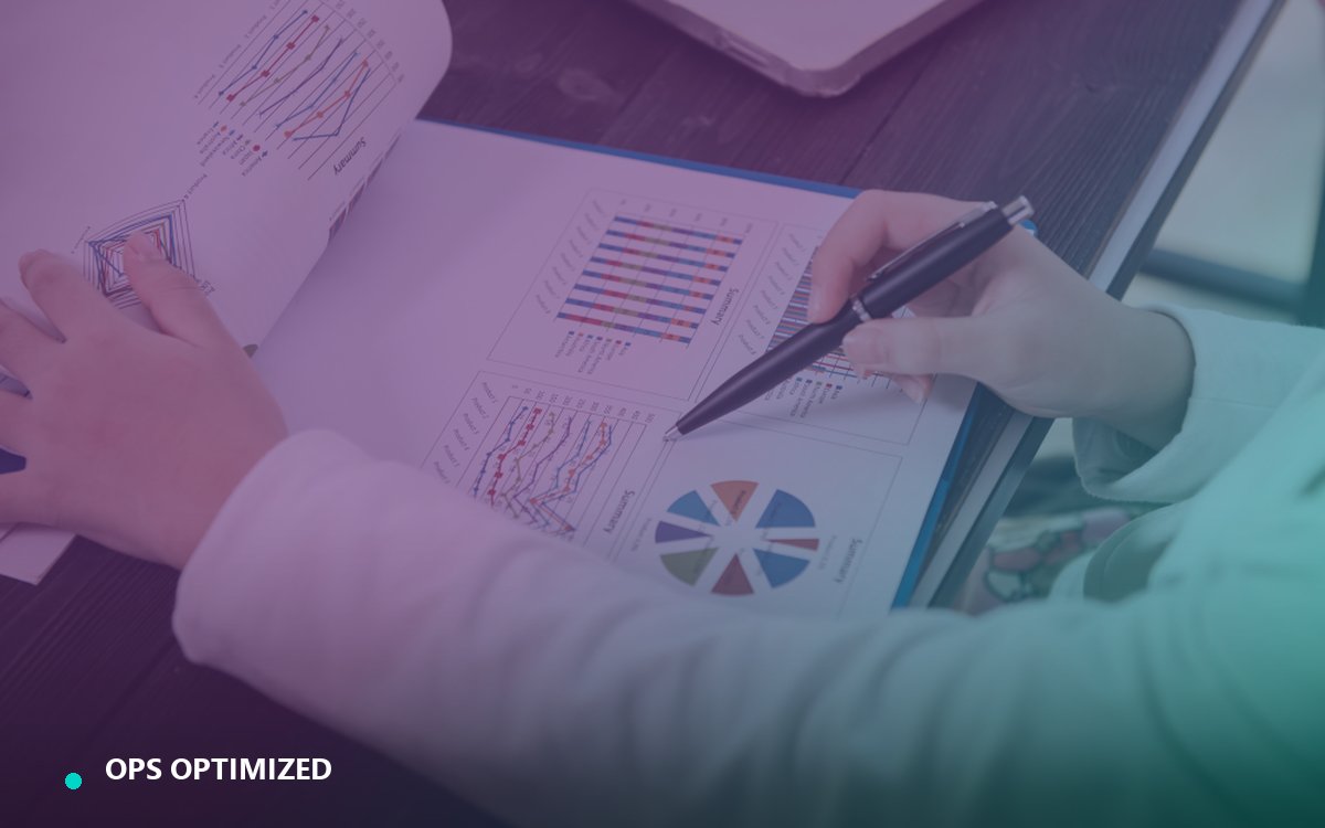 A founder reviewing charts and operations reports in a printed business summary
